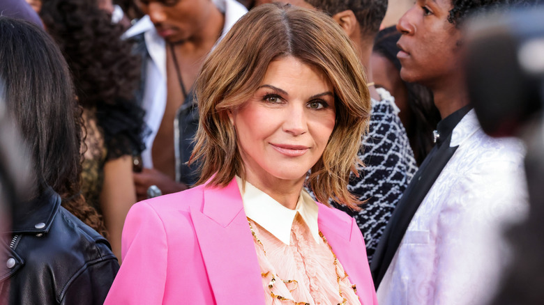 Lori Loughlin in a pink suit.