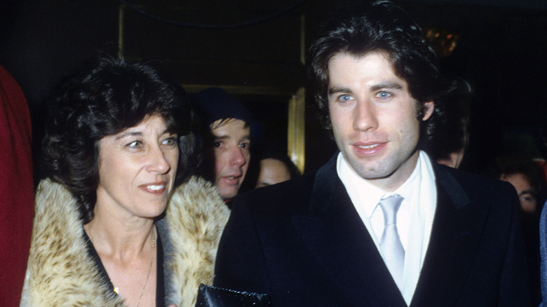 Ellen and John Travolta pictured together in their younger years.