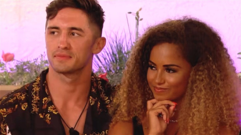Greg O'Shea and Amber Gill sitting together