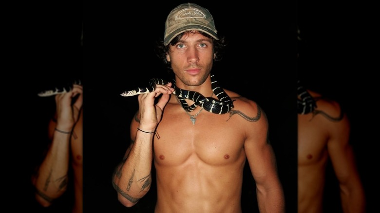 Rob Rausch with a snake wrapped around his neck