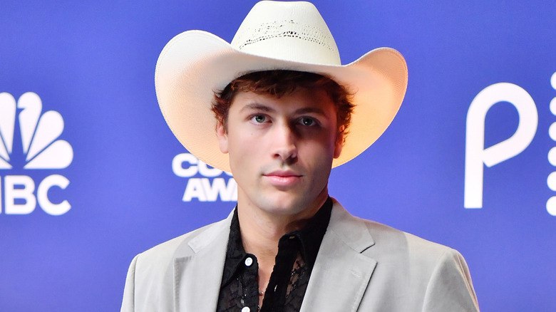 Rob Rausch on the red carpet wearing a cowboy hat