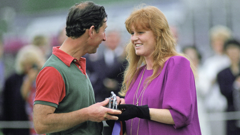 Sarah Ferguson presenting then-Prince Charles with an award at a polo match.