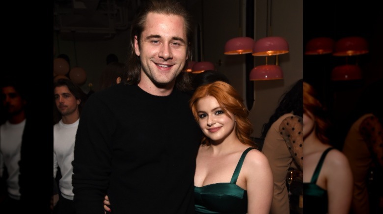 Luke Benward and Ariel Winter smiling and embracing 