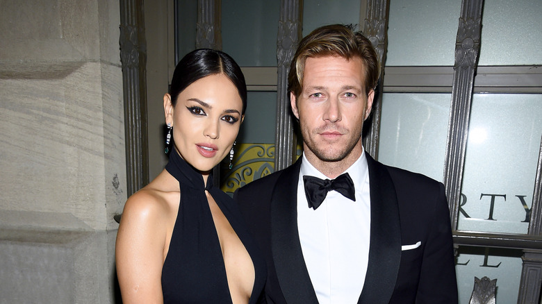 Eiza González and Luke Bracey posing at an event in their finery