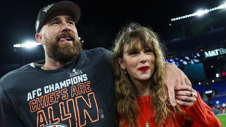 Travis Kelce and Taylor Swift smiling