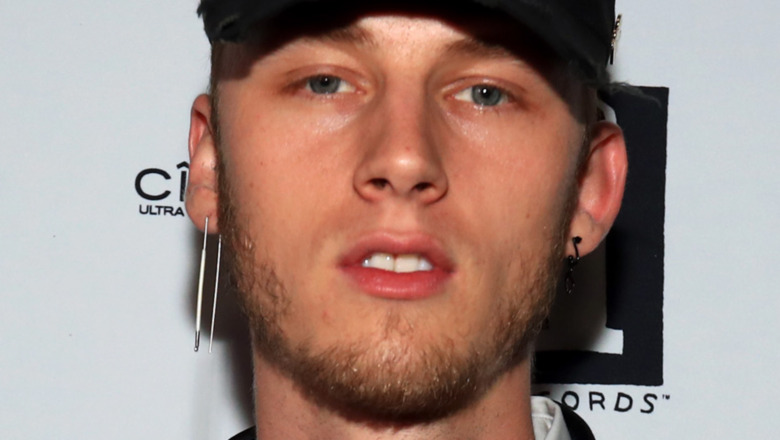 Machine Gun Kelly gazing into camera