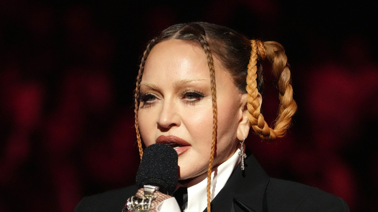 Madona holding a mic