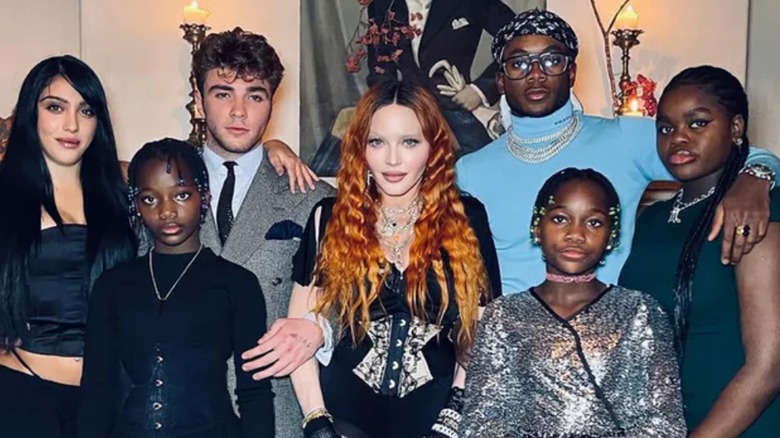 Madonna posing with six kids