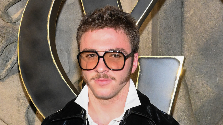 Rocco Ritchie short hair glasses moustache