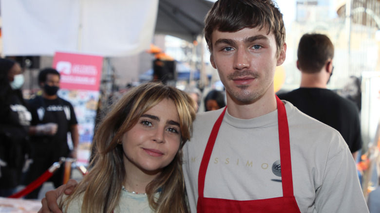 Mae Whitman posing with Miles Heizer