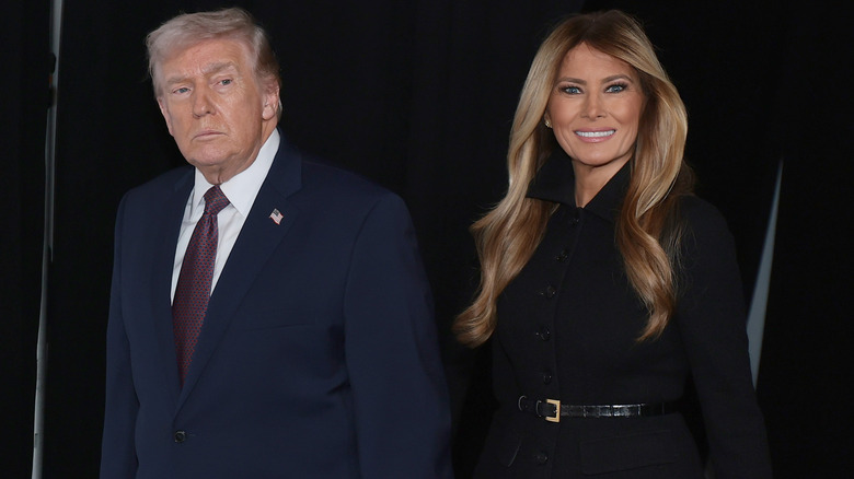 Donald and Melania Trump holding hands