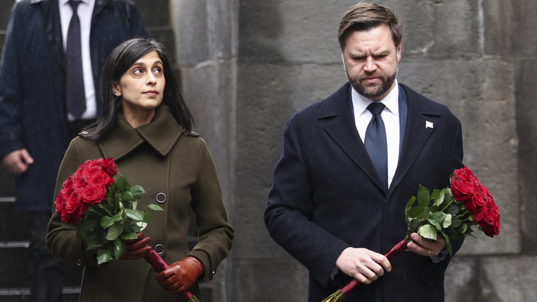JD Vance and wife Usha Vance hold flowers at the Eternal Flame during a visit to the Armenian Genocide Memorial on February 10, 2026.