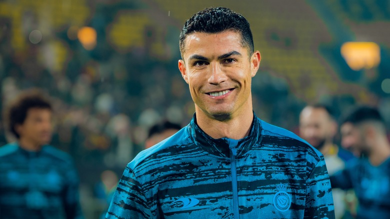 Cristiano Ronaldo smiling on the soccer field 