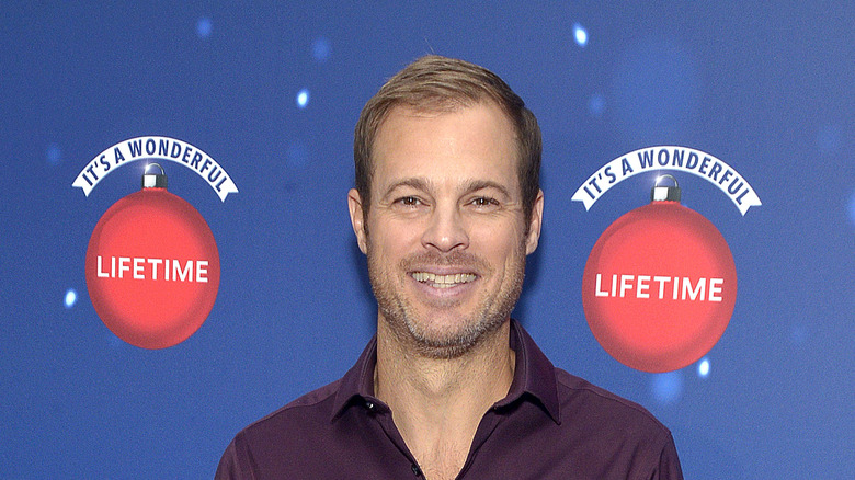 George Stults posing at an event