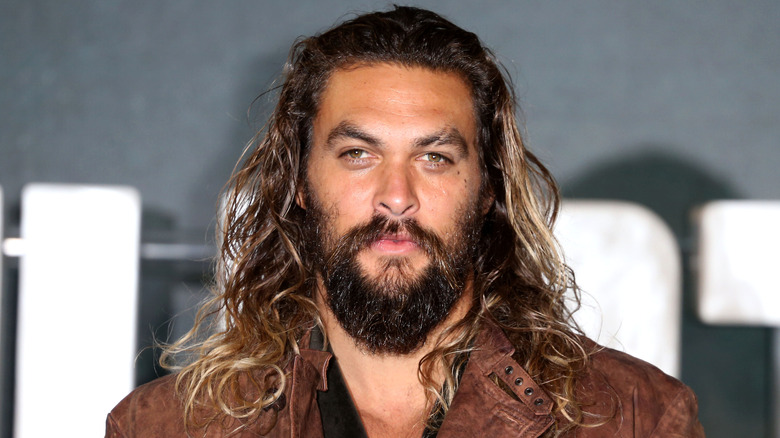 Jason Momoa posing at an event