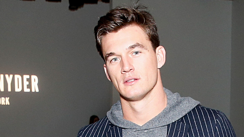 Tyler Cameron posing at a fashion show