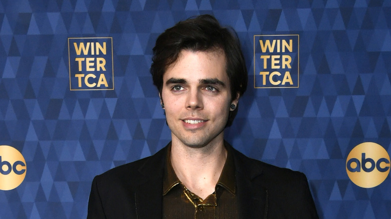 Reid Ewing posing at an event