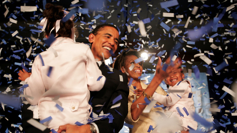 Malia Obama with President Barack Obama and Michelle Obama