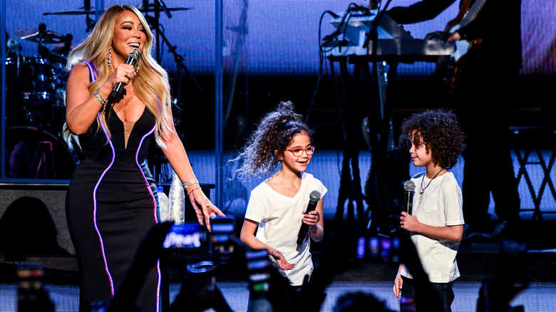 Mariah Carey onstage with twins