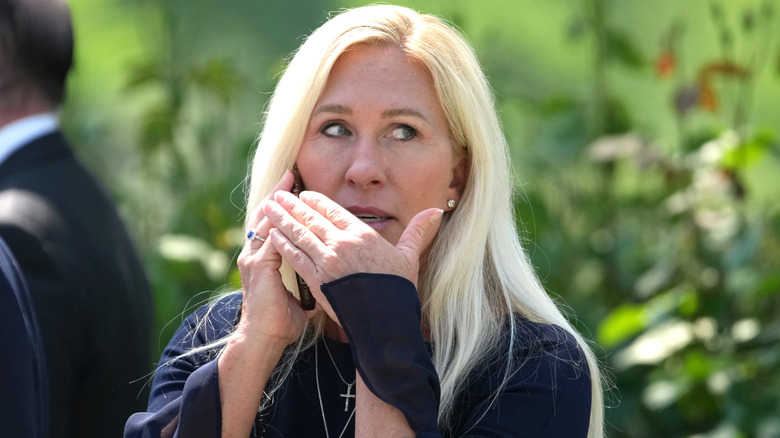 Marjorie Taylor Greene making a phone call.