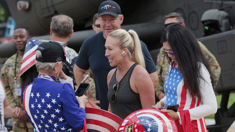 Marjorie Taylor Greene and Brian Glenn interacting with fans.