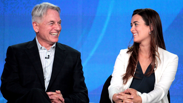 Mark Harmon and Cote de Pablo laugh during an interview
