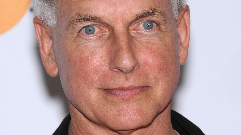 Mark Harmon poses in a black shirt