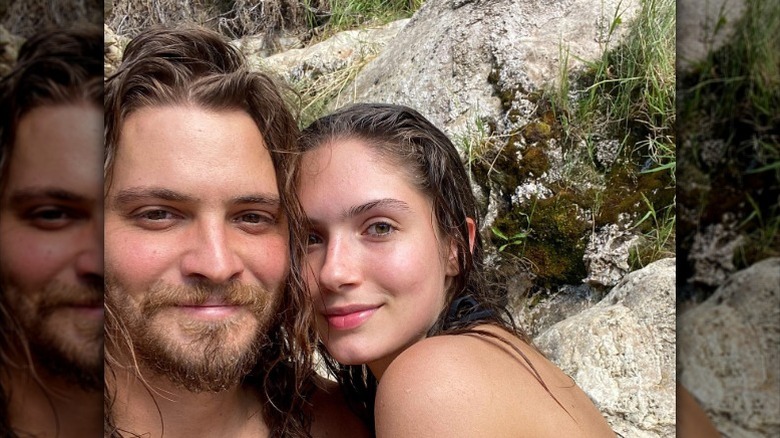 Luke Grimes and Bianca Rodrigues pose in nature