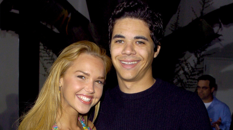 Arielle Kobbel leans toward Brahman Turner as they both smile in 2004