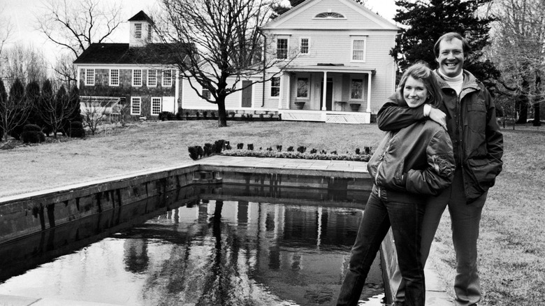 Caterer Martha Stewart and husband, publisher Andy Stewart, posing outside their home,