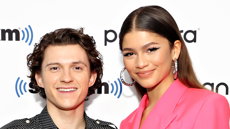 Tom Holland and Zendaya smiling together