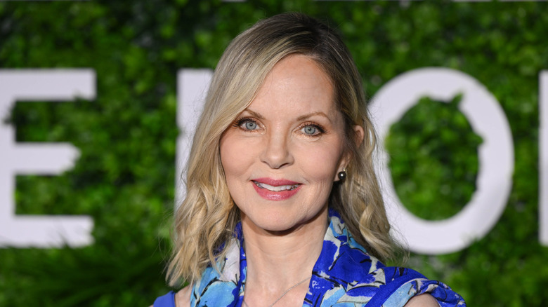 Melissa Sue Anderson smiling while posing for the camera in a blue patterned shirt