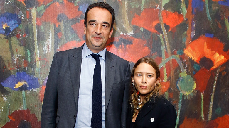 Olivier Sarkozy and Mary-Kate Olsen pose at an event