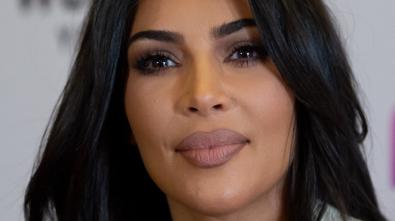 Kim Kardashian purses lips