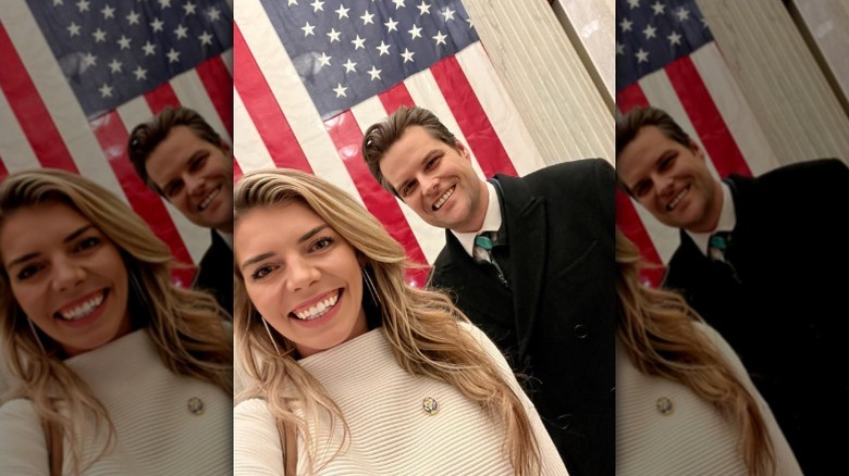 Ginger and Matt Gaetz take a selfie in front of U.S. flag