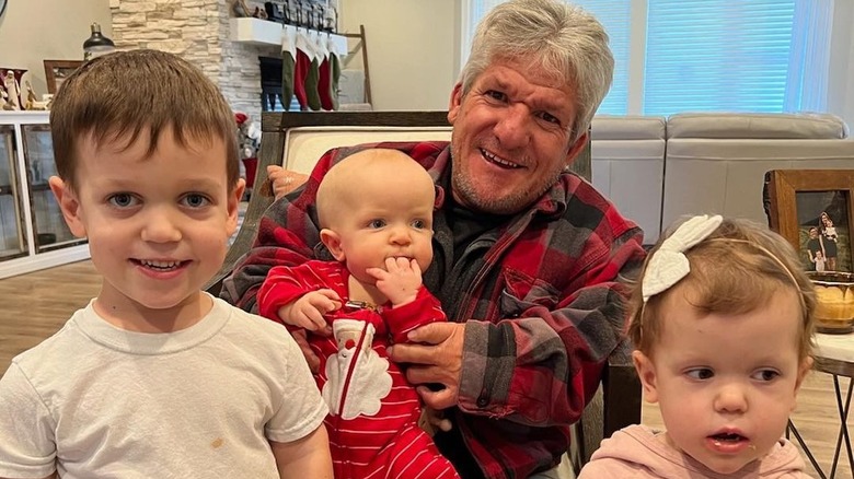 Matt Roloff smiling with children