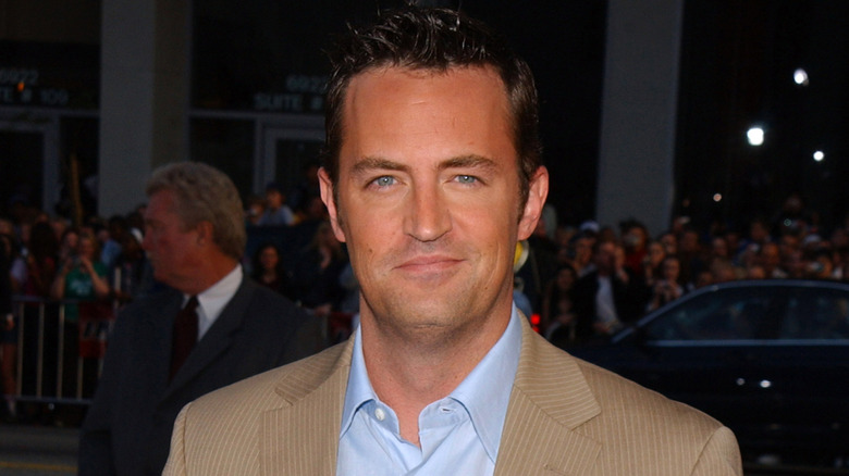 Matthew Perry in tan suit