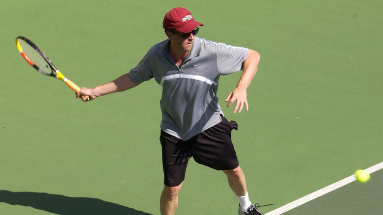 Matthew Perry playing tennis
