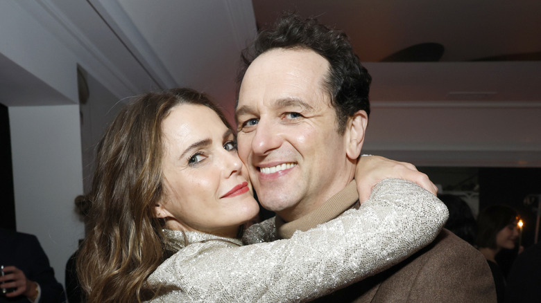 Matthew Rhys and Keri Russell hug in January 2026.