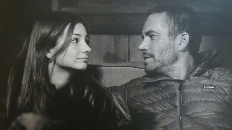 A teen Meadow and her dad looking at each other