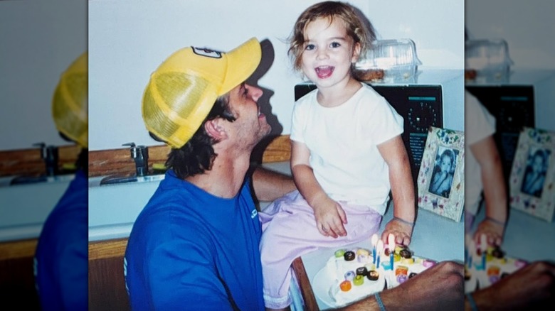 A young Meadow laughing with her dad