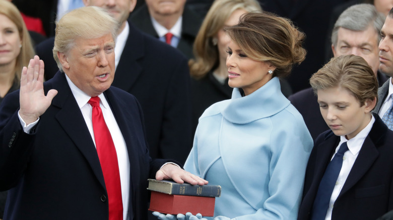 Barron Trump looks bored as Donald Trump takes the oath of office 