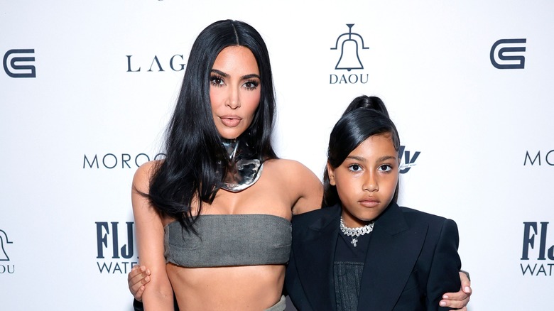 North West and Kim Kardashian pose together