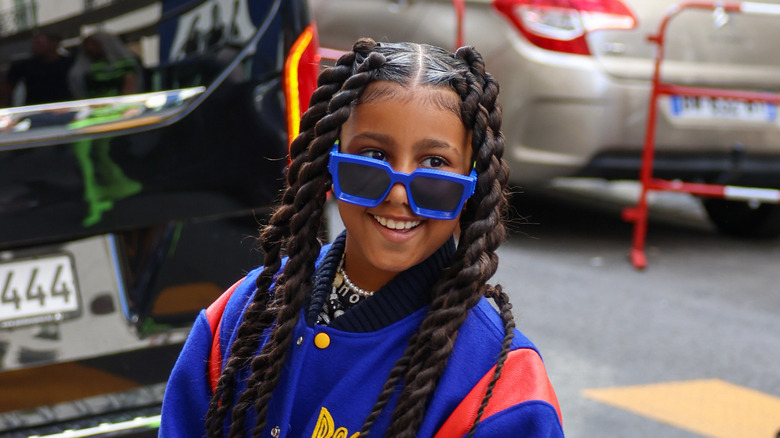 North West smiling with shades