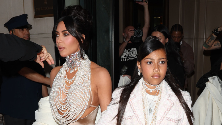 North West walks with Kim Kardashian