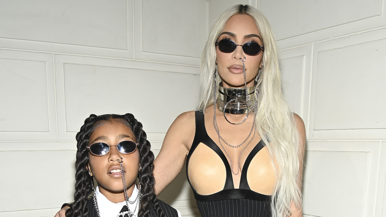 Kim Kardashian poses with North West