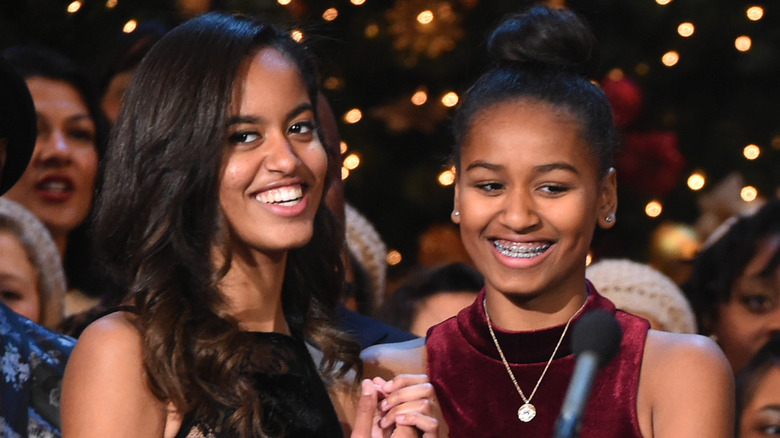 Malia and Sasha Obama laughing