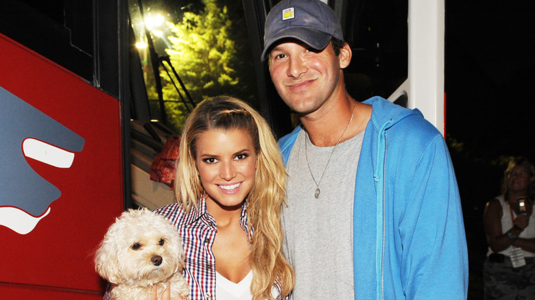 Jessica Simpson and Tony Romo posing