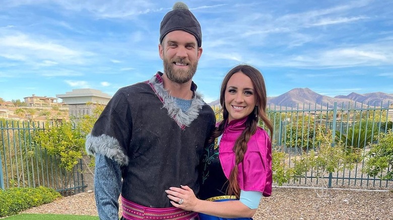 Kayla Harper posing with Bryce Harper outside