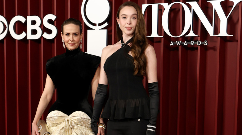 Ella Beatty and Sarah Paulson wearing black ensembles at the 2025 Tony Awards.